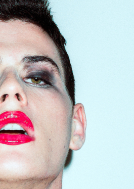 photography. Man face close up with red lipstick 