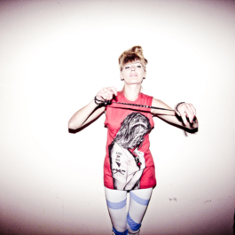 Photography. Fashion editorial. Model wear red printed t-shirt and blue/white leggings 