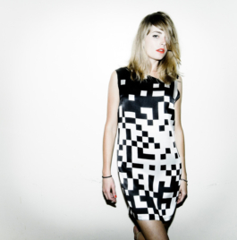 Photography. Fashion editorial. Model wearing a printed black and white silk dress. 