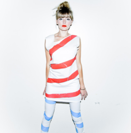Photography. Fashion editorial. Model wear red striped white jersey dress and and blue/white leggings 