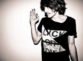 Photography. Black & white. . Young male model. posing with a black punk t-shirt 