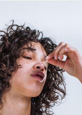 photography. Face close up. Model playing with a chewing gum. Canon 5d 