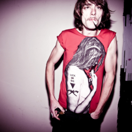 photography. Male model wearing red printed t-shirt. 