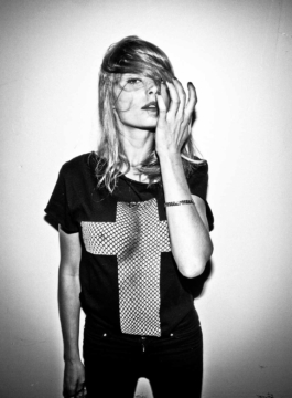 Photography. Photography. Fashion editorial. Model wears Black t-shirt with fishnet cross printed on front. Black & white photography. 