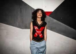 photography. nightshot. Flash. Model posing in front of a painted wall. razzle dazzle 