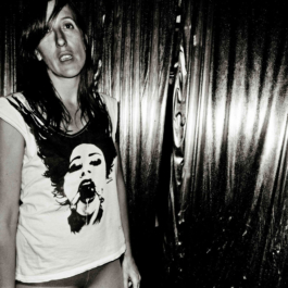 Photography. Black & white. Girl wearing white printed t-shirt and tights 