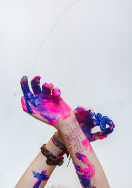 Photography. close-up of hands full of paint. 