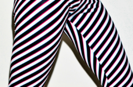 Art direction. Close up photo. Leggings with blue/red stripes. Fashion editorial. 