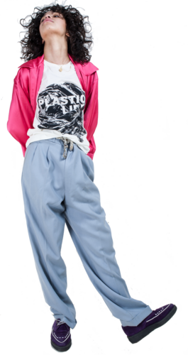 Photography. Fashion editorial. Model wearing white printed t-shirt and pink silk jacket. 